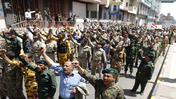Army and police officers loyal to the Shi'ite Houthi group march during a demonstration in Yemen's capital Sana'a, on June 4, 2014. (Reuters/Khaled Abdullah)