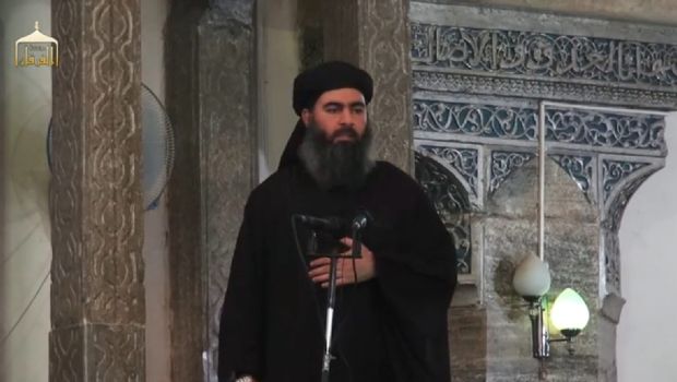 A photograph made from a video released on July 5, 2014 by the jihadist-affiliated group Furqan Media via their twitter account allegedly showing Islamic State of Iraq and Syria (ISIS) leader Abu Bakr Al-Baghdadi delivering a sermon during Friday prayers at a mosque in Mosul, Iraq, on July 4, 2014. (EPA Photo)