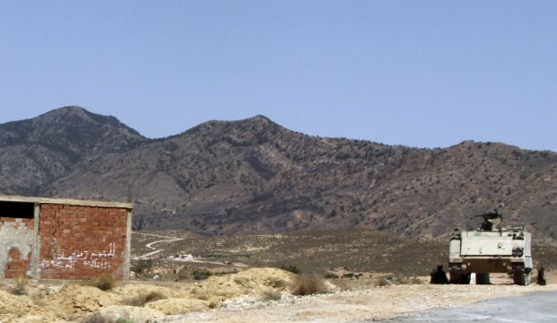 A Tunisian army armored personnel carrier patrols near the Jebel Chaambi mountains, on June 25, 2013 (AP Photo/Paul Schemm, File)