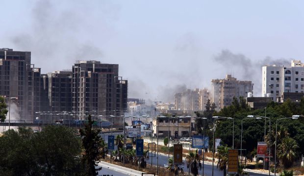 Smoke billows from the site of clashes on the road leading to the airport in the Libyan capital Tripoli, on July 20, 2014. (AFP PHOTO/MAHMUD TURKIA)