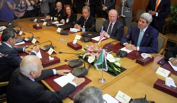 US Secretary of State John Kerry (R) and Arab League Secretary General Nabil al-Arabi (2-L, back to camera) with their respective delegations meet for talks in Cairo, Egypt, 22 July 2014. (EPA/STRINGER)