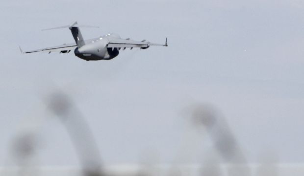 A Royal Australian Air Force Boeing C-17 transporting some of the remains of the victims of the crashed Malaysia Airlines MH17 plane ascends after taking off at Kharkiv airport on July 24, 2014. (REUTERS/Valentyn Ogirenko)