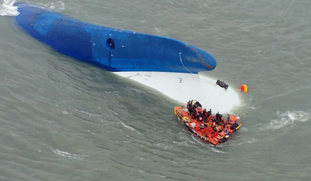 File photo of South Korean Coast Guards searching for passengers near a ferry that capsized on its way to Jeju island from Incheon, in April 2014. (AFP PHOTO / FILES / South Korea Coast Guard)