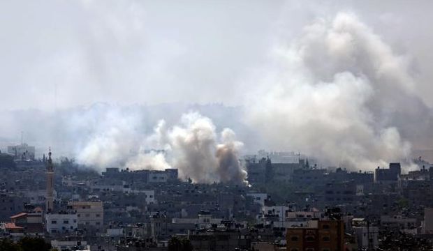 Smoke rises after Israeli tanks shell the Shejaia neighborhood during a military operation in the east of Gaza City, on July 27, 2014. (EPA/Mohammed Saber)