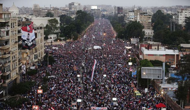 File photo showing Egyptian crowds protesting against former president Mohamed Mursi on June 30, 2013. (AP Photo/Hassan Ammar)