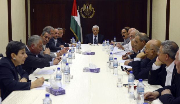 A handout photo released by the Palestine Authority of President Mahmoud Abbas chairing a meeting of the Political Committee of the Palestinian leadership in Ramallah on July 29, 2014. (EPA)