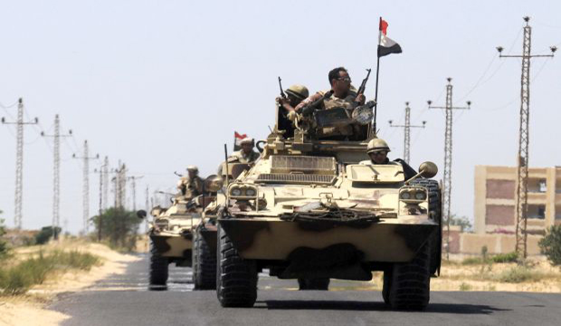 Armored personnel carriers (APC) of the Egyptian Army patrol on a road close to El Gorah in northeastern Sinai, Egypt, 21 May 2013. (EPA)