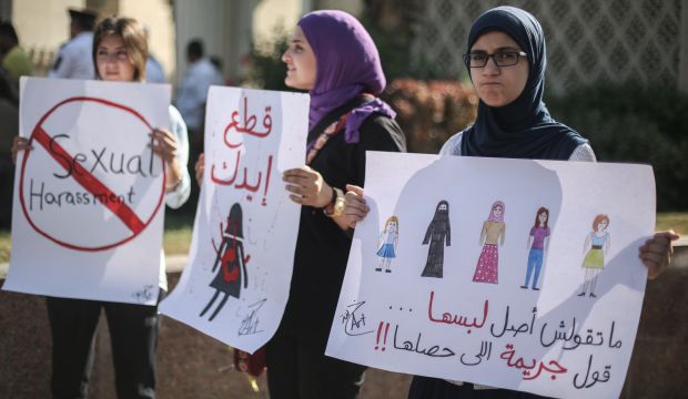 Egyptian women hold signs during a protest against sexual harassment in Cairo, Egypt on June 14, 2014. (Ahmed Ismail/Anadolu Agency/Getty Images)