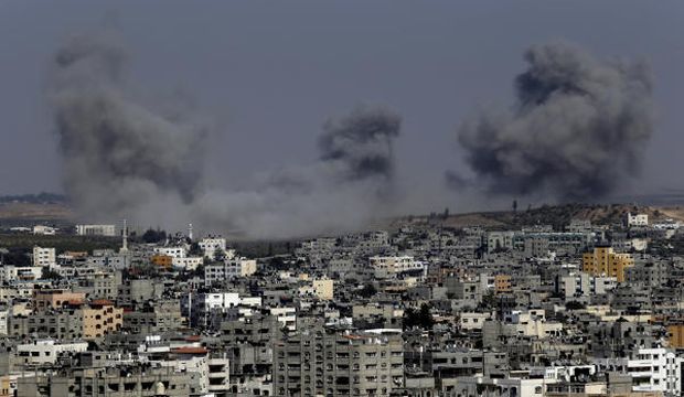 Smoke rises after an Israeli strike hit Gaza City, northern Gaza Strip, Thursday, July 31, 2014. (AP Photo/Lefteris Pitarakis)