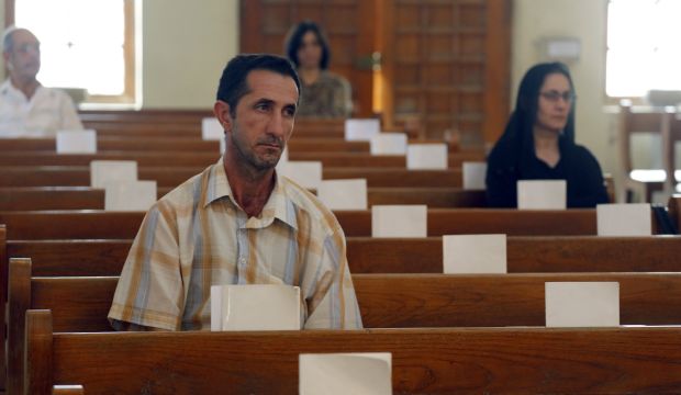Iraqi Christians attend Sunday mass at the Virgin Mary Chaldean church (Church of Our Lady of Sacred Heart) in the Karrada neighborhood of the capital Baghdad on July 20, 2014. (AFP/Sabah Arar)