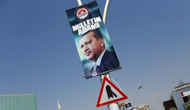 A presidential election campaign banner of Turkey's Prime Minister Tayyip Erdogan, with a slogan that reads "Man of the nation", hangs on a street near his ruling AK Party headquarters in Ankara August 11, 2014. (REUTERS/Murad Sezer) 