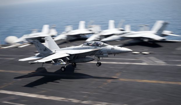 A US Navy F-18 Hornet coming from Iraq lands on the flight deck of the  USS George H.W. Bush on August 15, 2014 in the Gulf. (AFP PHOTO/MOHAMMED AL-SHAIKH)