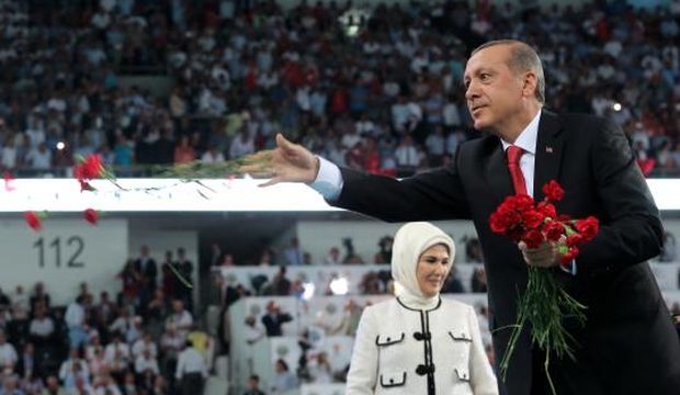 Turkish President-elect Recep Tayyip Erdoğan (R) throws flowers to his supporters during a congress of Turkey's ruling Justice and Development Party (AKP) for the election of a new prime minister in Ankara, Turkey, August 27, 2014. (EPA/Stringer)