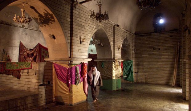 File photo showing a Yazidi cleric walking through the main temple in Laliş, in Nineveh Province in northern Iraq. (Reuters/Shamil Zhumatov) 