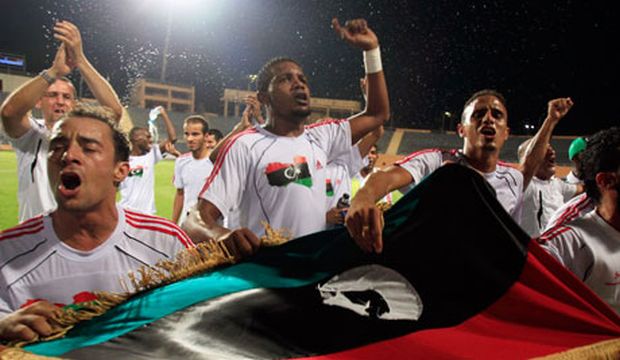 The Libyan national soccer team players celebrate with a Kingdom of Libya flag after winning against Mozambique during their 2012 African Cup of Nations qualifying soccer match at Petro Sport Stadium in Cairo, Egypt on September 3, 2011. (Reuters)