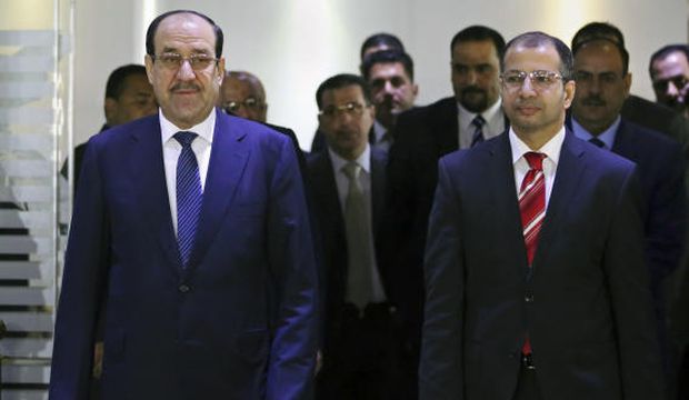 Iraqi Prime Minister Nuri Al-Maliki (L) walks with the Sunni Speaker of Parliament Salim Al-Jabouri during a press conference in Baghdad, Iraq, on Saturday, July 26, 2014. (AP Photo/Hadi Mizban)
