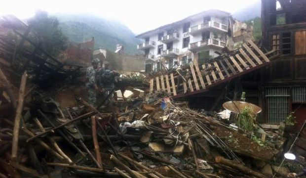 Rescue workers operate on collapsed buildings in Longtou, the epicenter of the August 3, 2014 earthquake, in Ludian county, Yunnan province, China, on August 4, 2014. (EPA) 