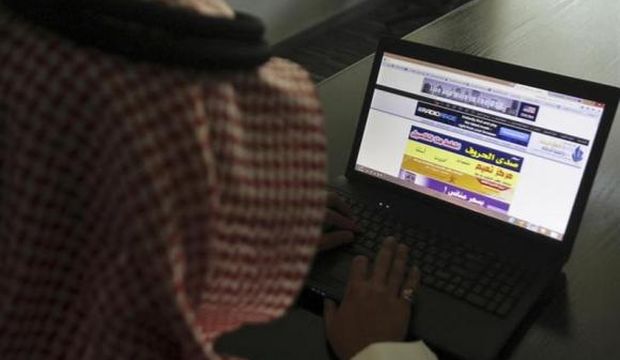 A Saudi man explores a website on his laptop in Riyadh in this file photo taken on February 11, 2014. (Reuters/Faisal Al-Nasser)