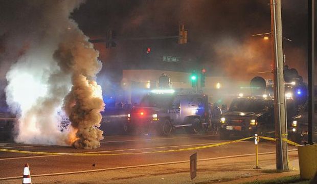 Law enforcement fires tear gas on protesters on West Florissant Road in Ferguson, Missouri on August 17, 2014. (AFP)