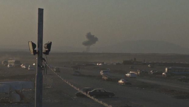 This image made from US Department of Defence video shows smoke rising from airstrikes targeting ISIS militants near the Khazer checkpoint outside of the city of Erbil in northern Iraq, on 08 August 2014.  (EPA)