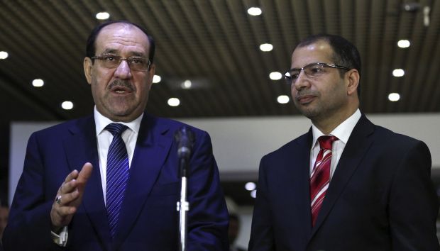 Iraqi Prime Minister Nuri al-Maliki (L) speaks next to speaker of parliament Salim al-Jubouri during a news conference after their meeting with in Baghdad July 26, 2014. (Reuters/Stringer) 