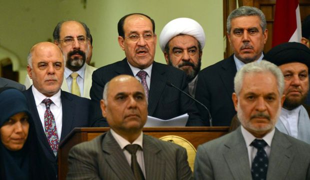 Iraq's prime minister of eight years, Nuri Al-Maliki, announces he is relinquishing his post to Haider Al-Abadi (2nd L) in Baghdad on August 14, 2014. (AP Photo/Iraqi Government)