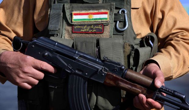 Iraqi Kurdish Peshmerga fighters take position on the front line in Khazer, near the Kurdish checkpoint of Aski Kalak, 25 miles (40 kilometers) west of Erbil, the capital of the autonomous Kurdish region of northern Iraq, on August 8, 2014. (AFP/Safin Hamed)
