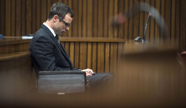 South African paralympic champion Oscar Pistorius is pictured ahead of the final arguments of his murder trial at the high court in Pretoria on August 7, 2014. (AFP Photo Pool/Mujahid Safodien)