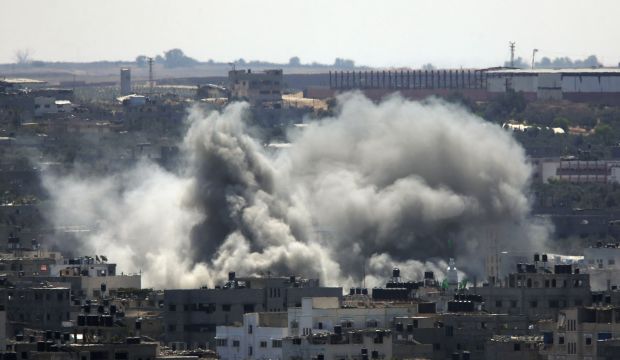Smoke rises over Gaza City after an Israeli strike, on August 8, 2014. (AP Photo/Lefteris Pitarakis)