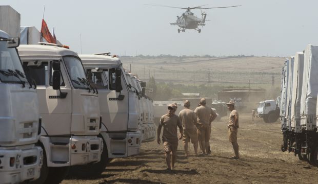 Convoy of Russian trucks carrying humanitarian aid wait 17 miles from the Ukrainian border in the Rostov-on-Don region, Russia, on August 14, 2014. (AP Photo/Pavel Golovkin)