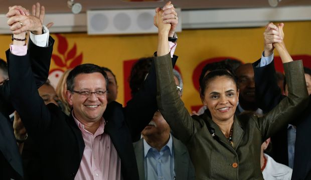 Brazilian Socialist Party (PSB) presidential candidate Marina Silva, (R), and her running mate Beto Albuquerque, celebrate the launch of their candidacy for the presidential elections in Brasilia, Brazil, on August 20, 2014. (AP Photo/Eraldo Peres)