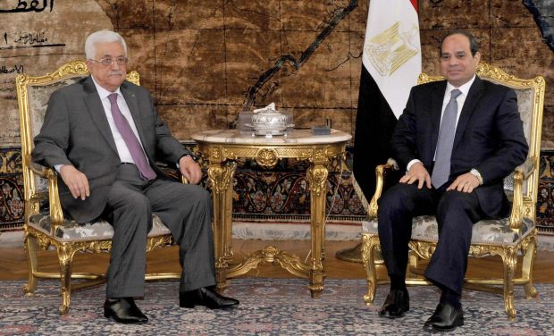 In this photo provided by Egypt's state news agency MENA, Egyptian President Abdel-Fattah El-Sisi, right, meets with Palestinian President Mahmoud Abbas in the presidential palace in Cairo Egypt, on Saturday, Aug. 23, 2014. (AP Photo/Ahmed Foad)