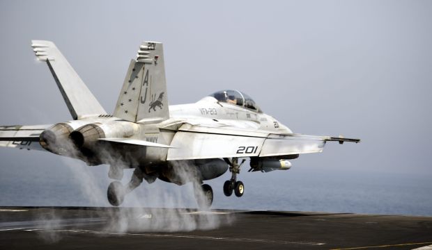 A US Navy F/A-18 Hornet launches off from the flight deck of the US Navy aircraft carrier USS George H.W. Bush in the Persian Gulf, at sea, 15 August 2014. (EPA/MAZEN MAHDI)