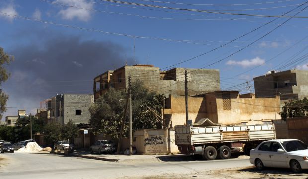 Smoke rises following an air strike in Libya's eastern coastal city of Benghazi on September 1, 2014. (AFP PHOTO/ ABDULLAH DOMA)