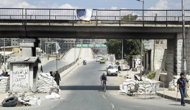Syrian rebel fighters man a checkpoint in the East Al-Ansari neighborhood of Aleppo, Syria, on September 7, 2014. (Reuters/Ammar Abdullah)