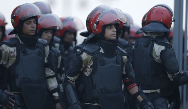 Egyptian military policemen stand guard before the Africa Cup of Nations Group G qualifying soccer match between Egypt and Tunisia in Cairo, Egypt, on Wednesday, September 10, 2014. (AP Photo/Hassan Ammar)