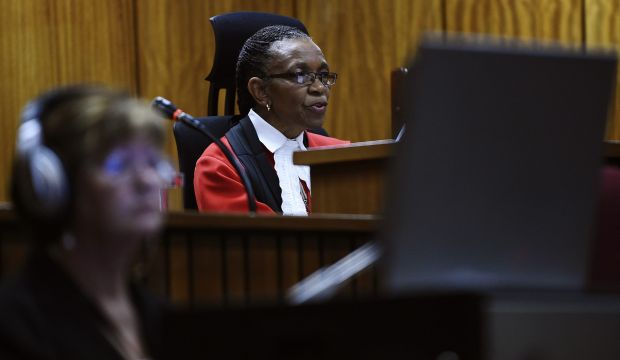 Judge Thokozile Masipa delivers her judgement in the trial of Olympic and Paralympic track star Oscar Pistorius at the North Gauteng High Court in Pretoria, September 11, 2014. (REUTERS/Phill Magakoe/Pool)