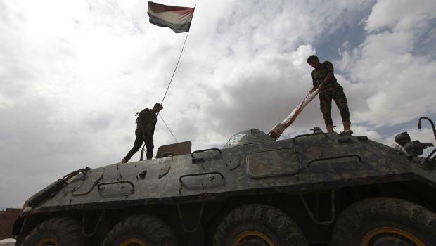 Police troopers stand on an armoured personnel carrier (APC) at a checkpoint in Sana'a. (Reuters Photos)
