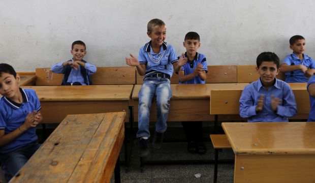 Palestinian students play in a classroom at a United Nations school in Gaza City on September 14, 2014 on the first day of the new school year. (AFP Photo/Mohammed Abed)