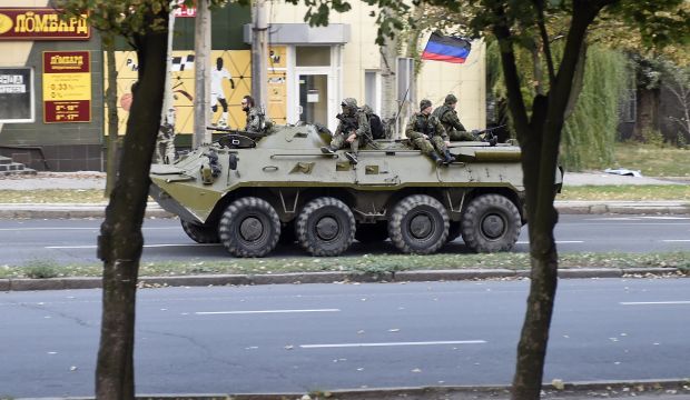 Pro-Russian militants patrol on an armored vehicle, on September 15, 2014 on a street in Donetsk, eastern Ukraine. (AFP PHOTO/PHILIPPE DESMAZES)