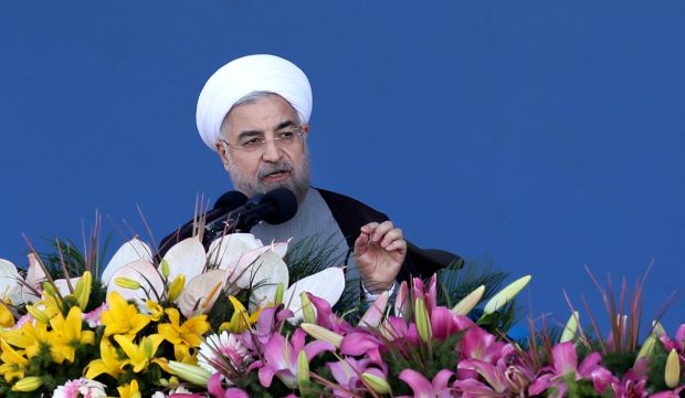 Iranian President Hassan Rouhani speaks during an annual military parade marking the 34th anniversary of outset of the 1980–88 Iran–Iraq war, in front of the mausoleum of the late revolutionary founder Ayatollah Khomeini, just outside Tehran, Iran, on Monday, September 22, 2014. (AP Photo/Ebrahim Noroozi)
