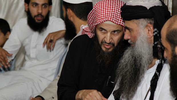 Radical Muslim cleric Abu Qatada listens to Islamist scholar Sheik Abu Muhammad Al-Maqdisi during a celebration after his release from a prison near Amman. (Reuters Photos)