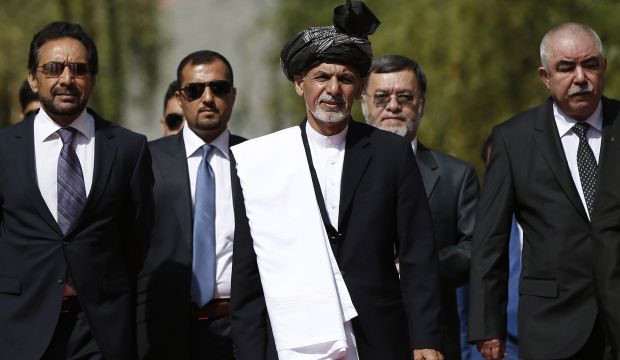 Newly-elected Afghan President Ashraf Ghani Ahmadzai, center, arrives for an inauguration ceremony at the presidential palace in Kabul, Afghanistan, on Monday, September 29, 2014. (AP Photo/Omar Sobhani, Pool)