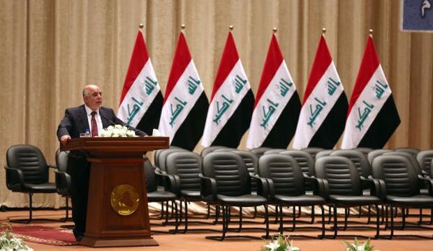 Iraq's new Prime Minister Haider Al-Abadi speaks to Iraqi lawmakers before submitting his government in Baghdad, Iraq, on Monday, September 8, 2014. (AP Photo/Hadi Mizban, Pool)