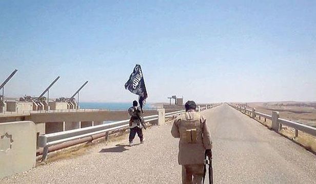 This file photo reportedly shows fighters from the Islamic State of Iraq and Syria (ISIS) on the Mosul Dam on August 9. (AFP Photo)