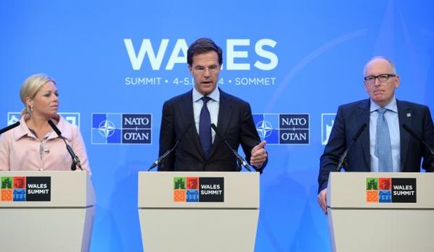Dutch Defense Minister Jeanine Hennis-Plasschaert, Dutch Prime Minister Mark Rutte, and Dutch Foreign Minister Frans Timmermans attend a press conference during the NATO Summit 2014 at the Celtic Manor Resort in Newport, Wales, United Kingdom, on September 4, 2014. (EPA/Facundo Arrizzabalaga)