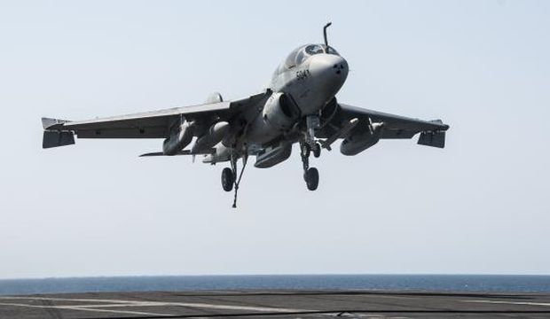 An EA-6B Prowler attached to the Garudas of Electronic Attack Squadron (VAQ) 134 lands aboard the aircraft carrier USS George HW Bush (CVN 77) after conducting strike missions against Islamic State of Iraq and Syria (ISIS) targets, in the Gulf, September 23, 2014, in this handout picture courtesy of the US Navy. (Reuters/Mass Communication Specialist 3rd Class Brian Stephens/US Navy/Handout via Reuters)