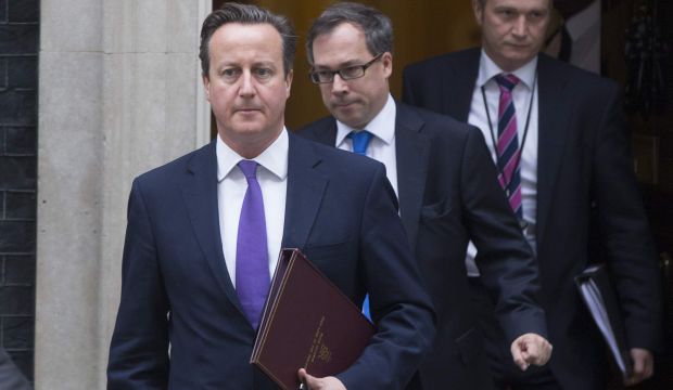 David Cameron leaves Downing Street for the House of Commons to win approval from parliament to join US-led air strikes on ISIS in Iraq on September 26, 2014. (Reuters/Neil Hall)