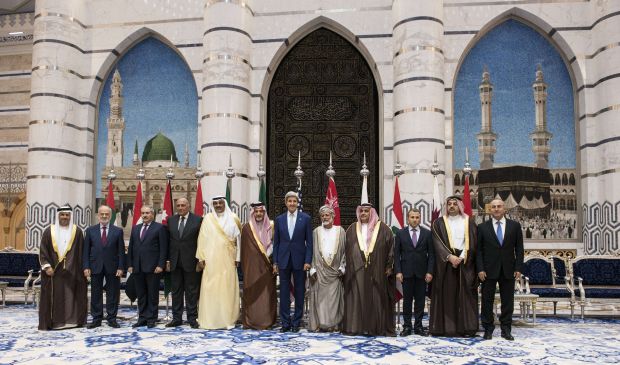 Participants of the Jeddah Conference stand together during a photo at the King Abdulaziz International Airports Royal Terminal on September 11, 2014 in Jeddah, Saudi Arabia.  (AFP Photo/Brenda N Smialowski)