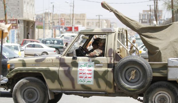 Shi'ite Houthi militants sit in a patrol vehicle that was taken from the army recently in Sana'a, Yemen, on September 26, 2014. (Reuters/Mohamed Al-Sayaghi)